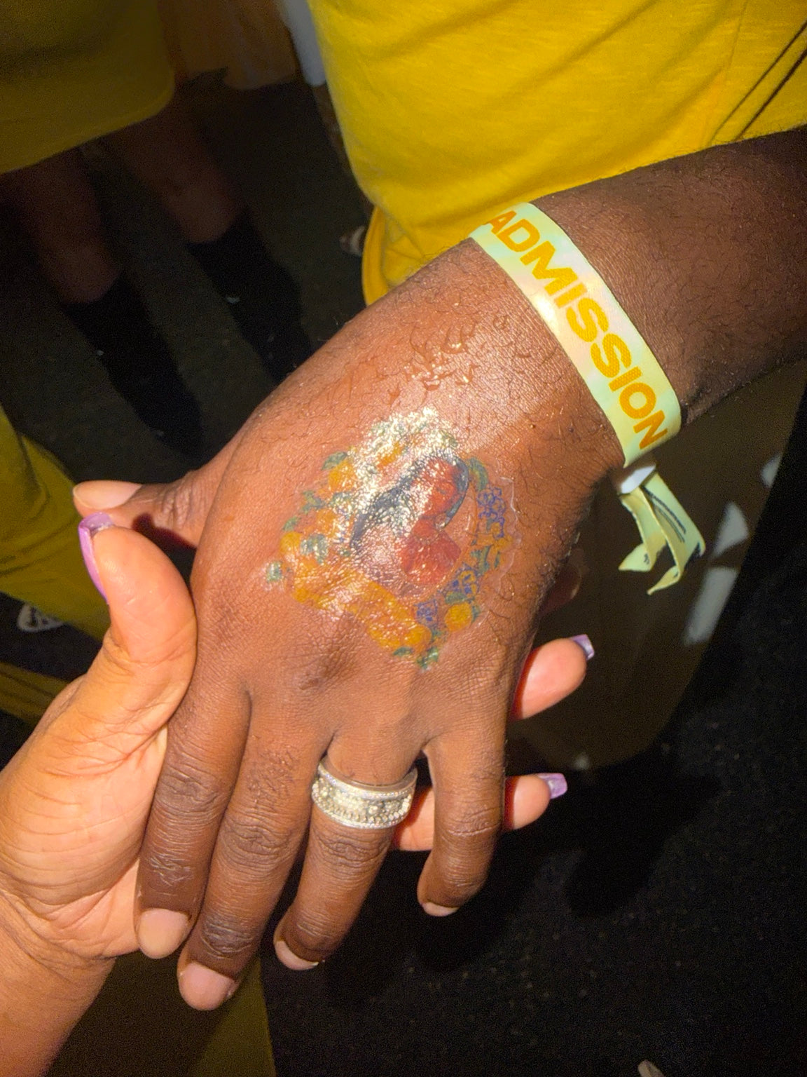 Personalized temporary tattoo party favor applied to hand