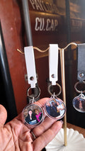 Luxe Spin Studio round photo keychains with white and black wrist straps at Bushwick Film Festival