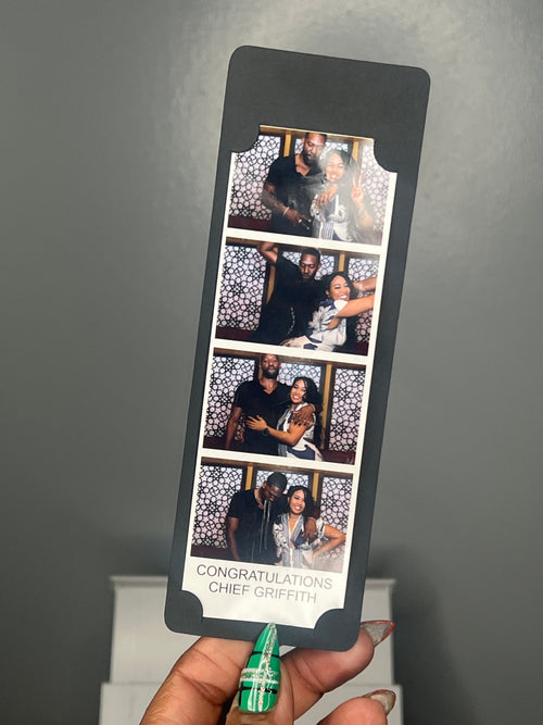 Finished black photo strip holder displaying a graduation photo strip.