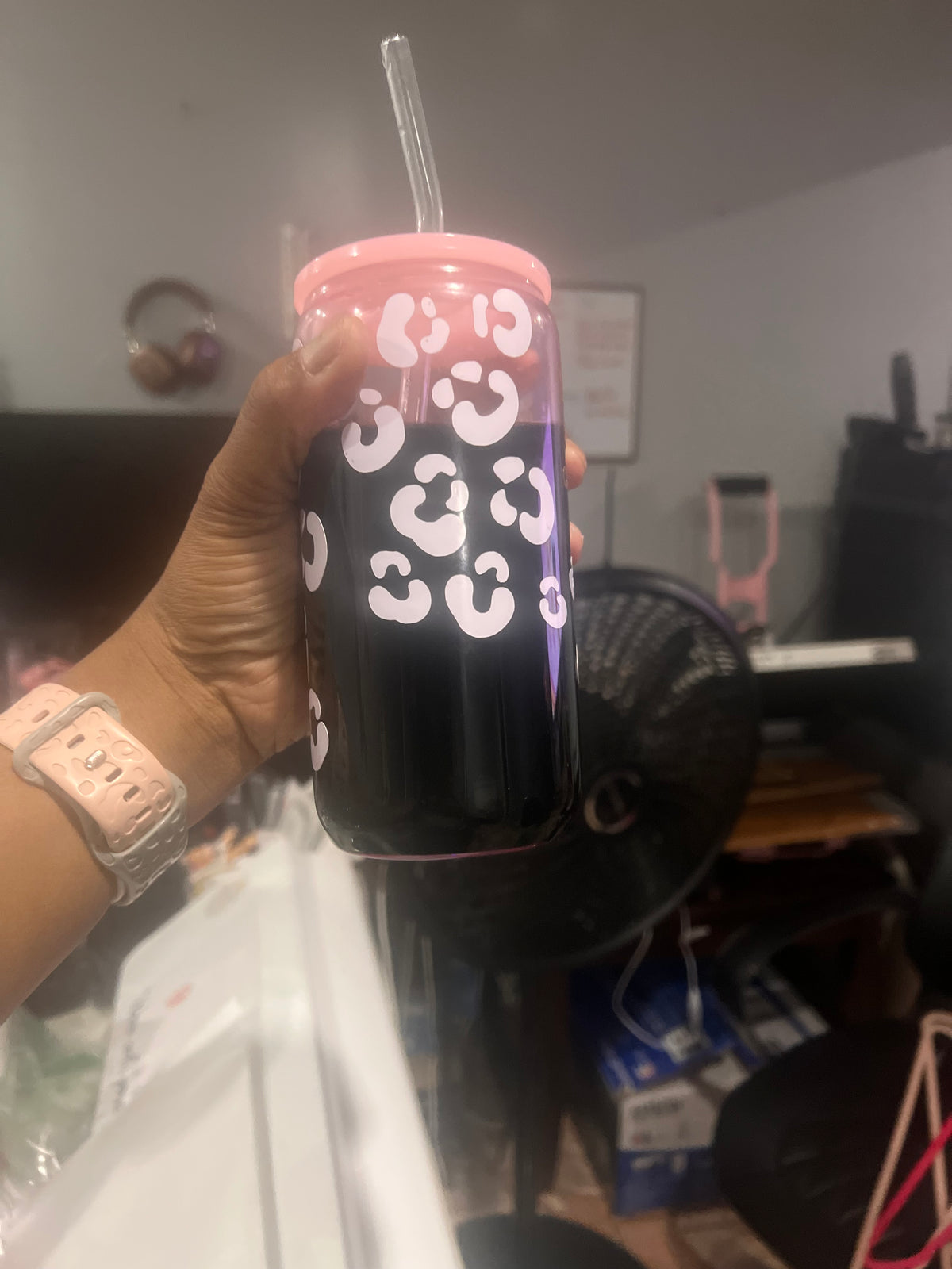 Personalized pink-and-black glass cup with white pattern, lid and straw.